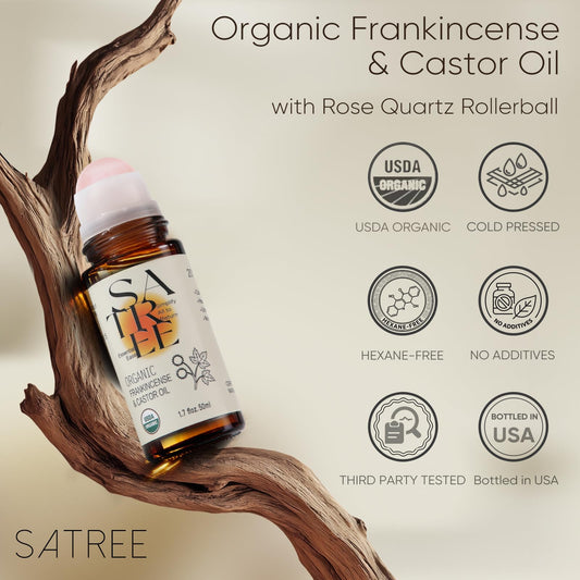 SATREE Organic Frankincense & Castor Oil rollerball on a wooden branch with certification icons.